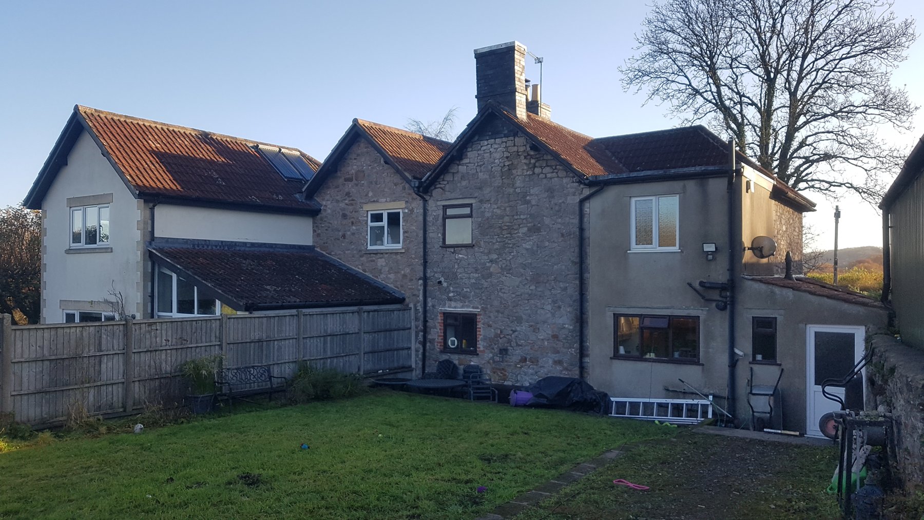 Rear of the stone cottage at survey, before the extension